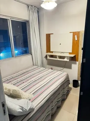 Uma cama ou camas num quarto em Recanto da praia
