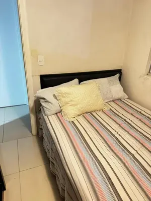 Uma cama ou camas num quarto em Recanto da praia
