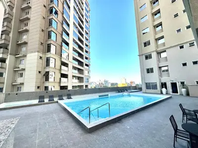A piscina em ou perto de Apto novo em Itapema - Prédio com piscina - 2 quartos sendo 1 suíte