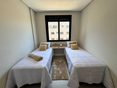 Uma cama ou camas num quarto em Apartamento em Governador Celso Ramos SC - Palmas