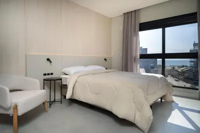 Uma cama ou camas num quarto em Brisas do Sul 202 - Praia do Mariscal
