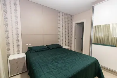 Uma cama ou camas num quarto em Mario Guilherme 305 - 2 Suítes - Praia do Centro