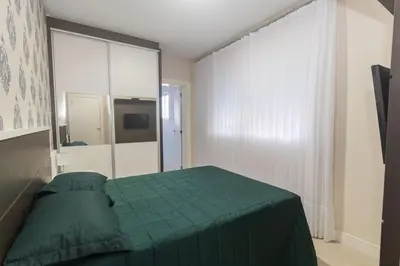 Uma cama ou camas num quarto em Mario Guilherme 305 - 2 Suítes - Praia do Centro
