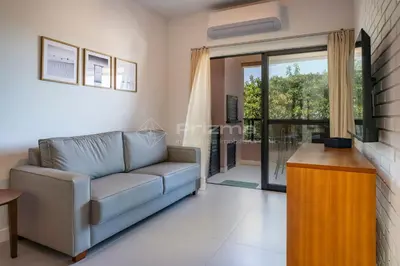 Uma área de estar em Apartamento na Praia de Bombas com Vista Mar Viva Suas Férias dos Sonhos!