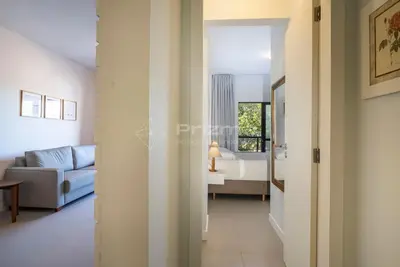 Uma área de estar em Apartamento na Praia de Bombas com Vista Mar Viva Suas Férias dos Sonhos!