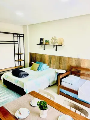Uma cama ou camas num quarto em Residencial Vila das Canoas
