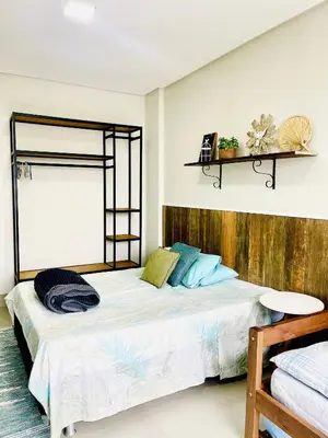 Uma cama ou camas num quarto em Residencial Vila das Canoas