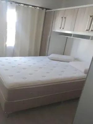 Uma cama ou camas num quarto em 2 dormitorios com Ar cond no centro