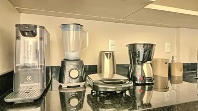 A cozinha ou kitchenette de Apto Palmas do Arvoredo, apenas 400 metros do mar
