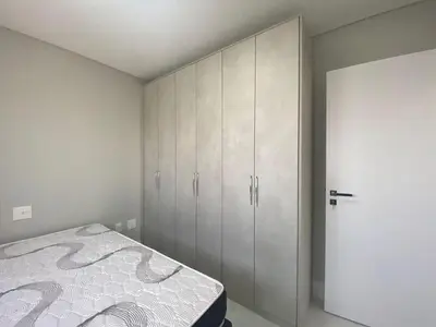 Uma cama ou camas num quarto em Apartmento em Pereque - Porto Belo