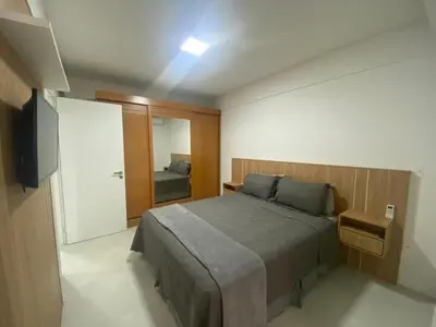 Uma cama ou camas num quarto em Meia Praia, Itapema SC 3 Suites, 2 vagas de garagem