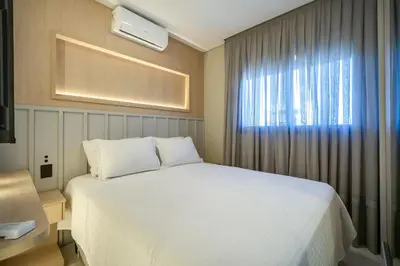 Uma cama ou camas num quarto em Apartamento alto padrão 3 quartos c/piscina