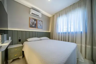 Uma cama ou camas num quarto em Apartamento alto padrão 3 quartos c/piscina