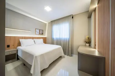 Uma cama ou camas num quarto em Apartamento alto padrão 3 quartos c/piscina