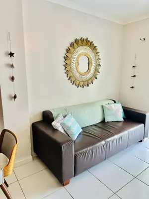 Uma área de estar em Incrível Apartamento vista mar a poucos passos da praia com 3 dormitórios