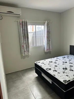 Uma cama ou camas num quarto em Casa para aluguel de temporada
