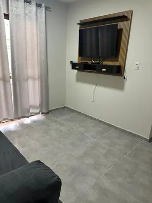 Uma televisão e/ou sistema de entretenimento em Casa para aluguel de temporada