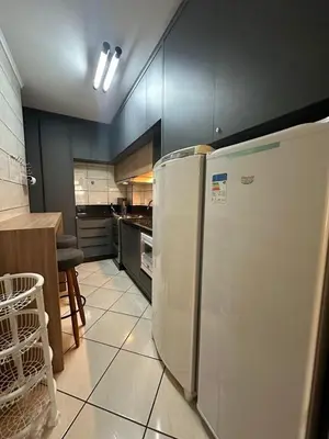A cozinha ou kitchenette de Apartamento aconchegante frente mar, na Meia Praia