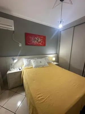 Uma cama ou camas num quarto em Apartamento aconchegante frente mar, na Meia Praia
