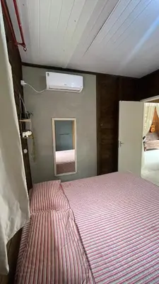 Uma cama ou camas num quarto em Marujos House