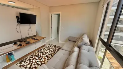 Uma televisão e/ou sistema de entretenimento em Cobertura Duplex para Locação de Temporada em Canto Grande!