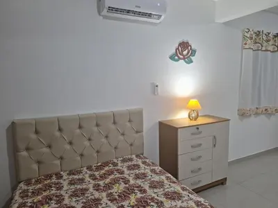 Uma cama ou camas num quarto em Studio Litorâneo para Relaxar