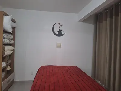 Uma cama ou camas num quarto em Studio Litorâneo para Relaxar