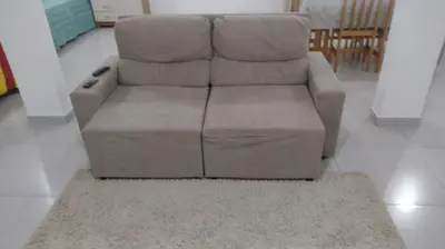 Uma área de estar em Studio Litorâneo para Relaxar