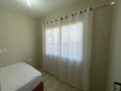 Uma cama ou camas num quarto em Casa para 9 Pessoas c Churrasqueira
