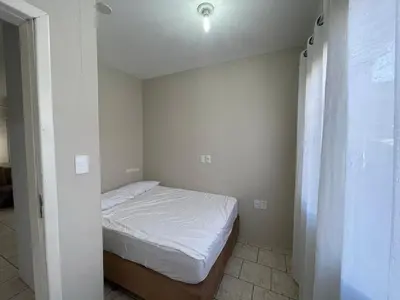 Uma cama ou camas num quarto em Casa para 9 Pessoas c Churrasqueira
