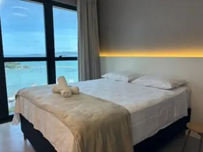 Uma cama ou camas num quarto em Studio com vista mar para até 3 pessoas em Itapema