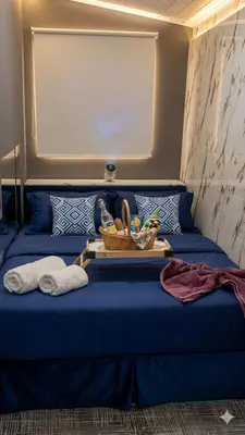 Uma área de estar em Suíte Infinity, Ar, Piscina, Spa, Wi-Fi, Eco WC