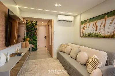Uma área de estar em Apto c/churrasq. próx. da Praia em Perequê FEL0502