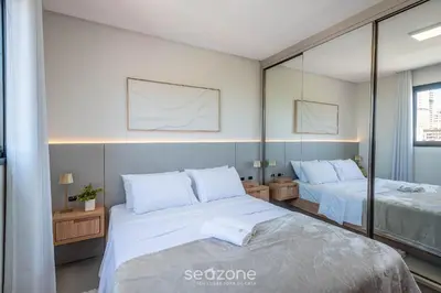 Uma cama ou camas num quarto em Apto c/churrasq. próx. da Praia em Perequê FEL0502