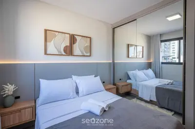 Uma cama ou camas num quarto em Apto c/churrasq. próx. da Praia em Perequê FEL0502