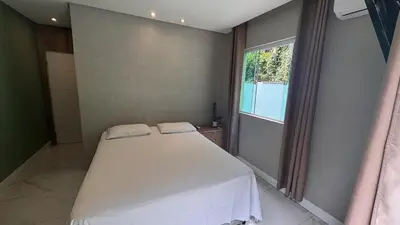 Uma cama ou camas num quarto em Casa na Praia Balneário Camboriú