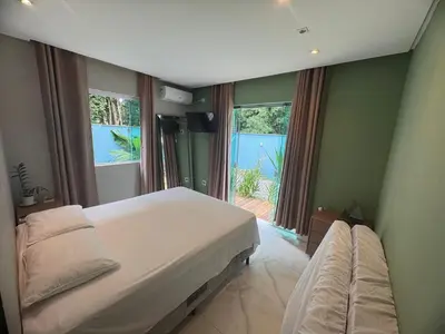 Uma cama ou camas num quarto em Casa na Praia Balneário Camboriú