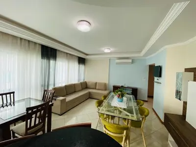 Uma área de estar em Apartamento Beira Mar