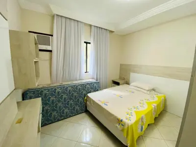 Uma cama ou camas num quarto em Apartamento Beira Mar