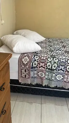 Uma cama ou camas num quarto em Casa de Temporada