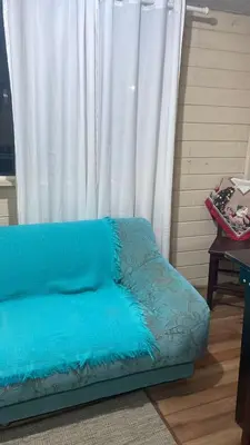 Uma área de estar em Casa de Temporada