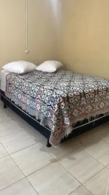 Uma cama ou camas num quarto em Casa de Temporada
