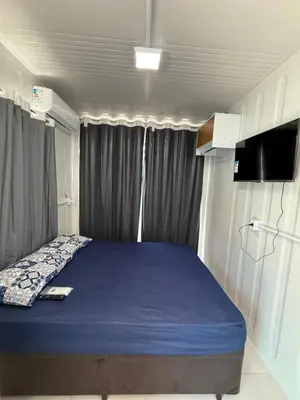 Uma cama ou camas num quarto em Containers Mariscal