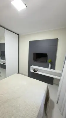 Uma cama ou camas num quarto em PRAIA de BOMBAS AP 303 RESIDENCIAL BREEZE
