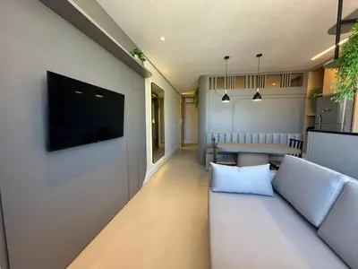 Uma televisão e/ou sistema de entretenimento em Jacuzzi e Piscina Aquecida • 120 m da Praia