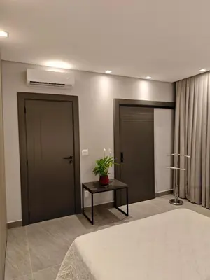 Uma cama ou camas num quarto em Casa Woods seu Refúgio na Praia do Estaleiro