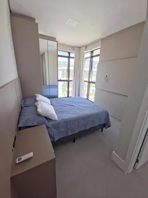 Uma cama ou camas num quarto em Apartamento praia de palmas