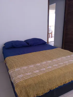 Uma cama ou camas num quarto em apto 02 01 dormitório canto grande