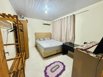 Uma cama ou camas num quarto em Casa com 3 Dormitórios em Zimbros