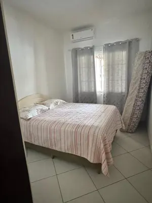 Uma cama ou camas num quarto em Casa 2 quartos em Zimbros - Bombinhas SC